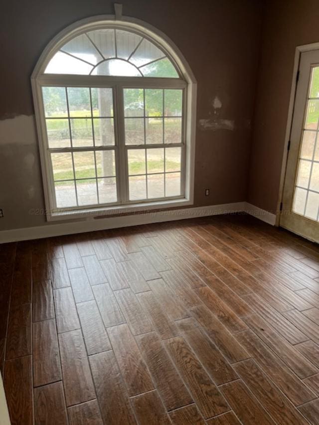130 Quail Run Dr, Winfield, AL 35594 - empty room with dark wood-type flooring and baseboards