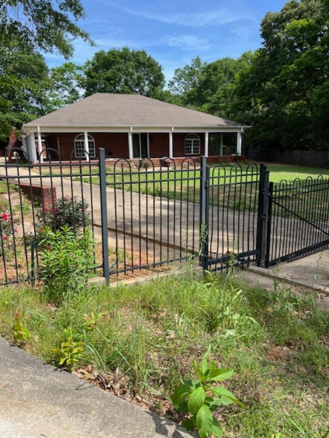 130 Quail Run Dr, Winfield, AL 35594 - view of front facade featuring roof with shingles and a gate