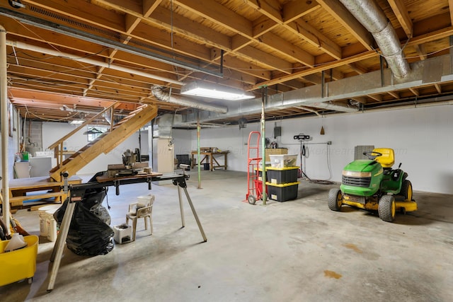 basement featuring stairs