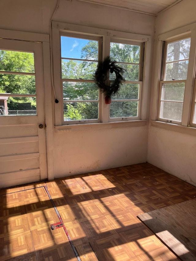 unfurnished sunroom featuring a healthy amount of sunlight
