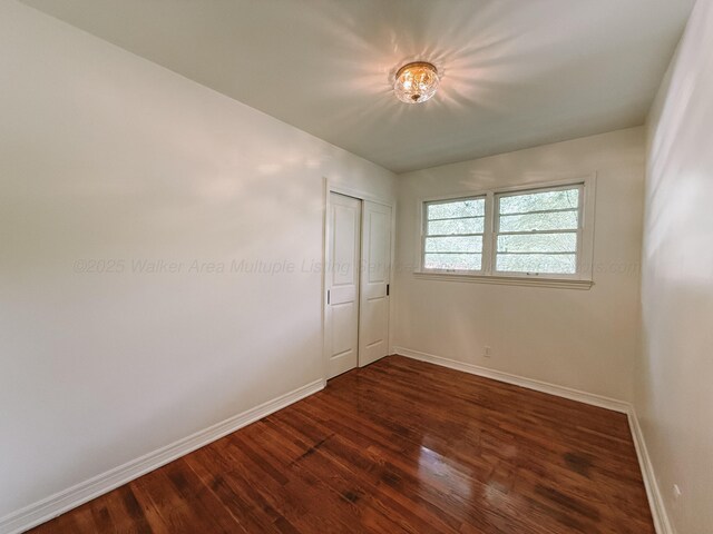 2301 E 20th Ave, Jasper, AL 35501 - unfurnished room with dark wood-type flooring and baseboards