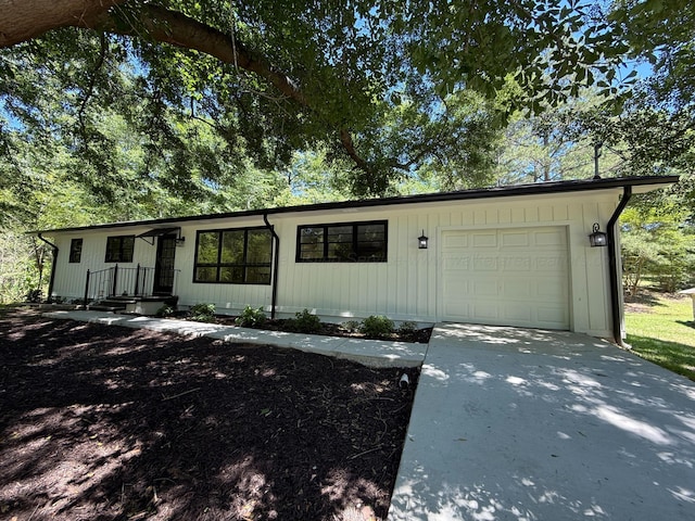 2301 E 20th Ave, Jasper, AL 35501 - single story home with a garage, concrete driveway, and board and batten siding