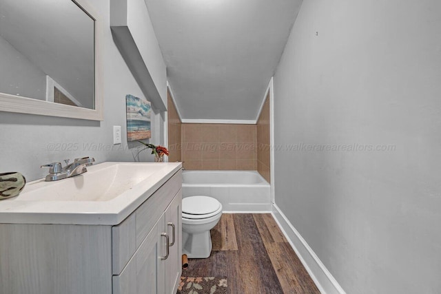 809 W 15th St, Jasper, AL 35501 - bathroom with vanity, wood finished floors, and a tub to relax in