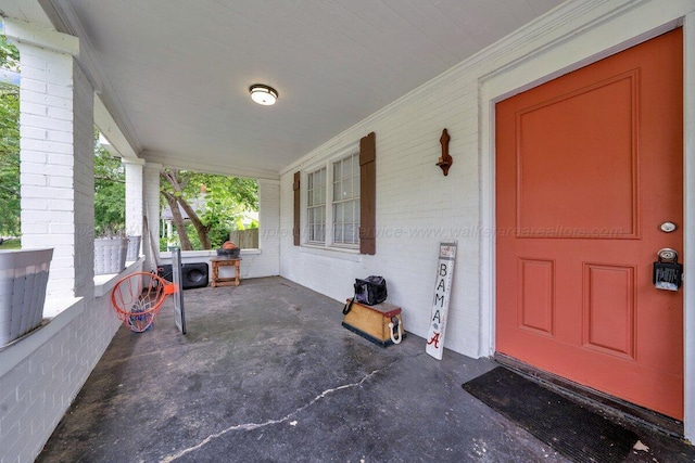 809 W 15th St, Jasper, AL 35501 - doorway to property with covered porch and brick siding