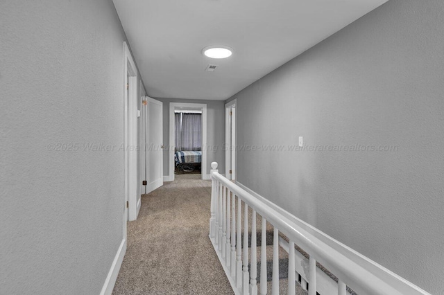 809 W 15th St, Jasper, AL 35501 - hallway with carpet, an upstairs landing, and a textured wall