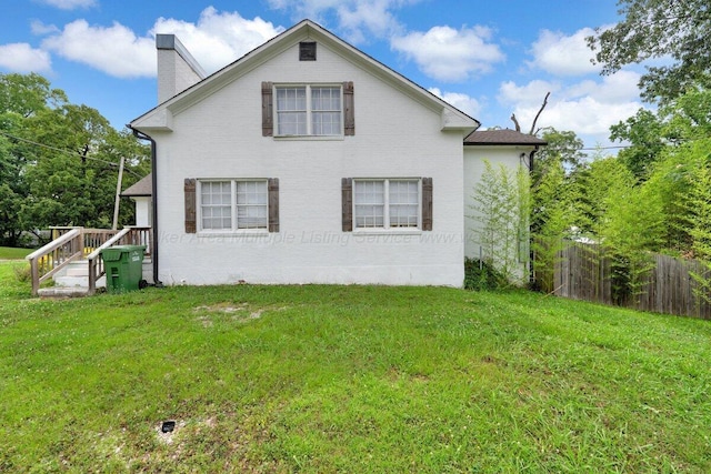 809 W 15th St, Jasper, AL 35501 - view of side of home featuring a chimney and brick siding