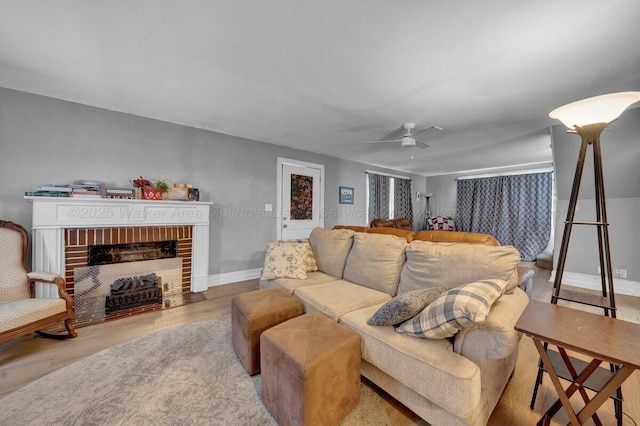 809 W 15th St, Jasper, AL 35501 - living area with a fireplace, wood finished floors, and ceiling fan