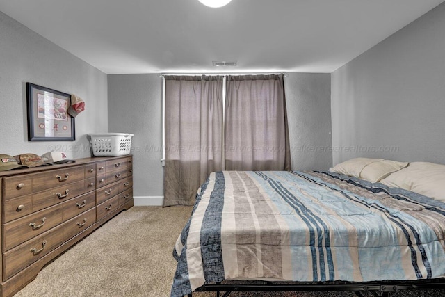 809 W 15th St, Jasper, AL 35501 - bedroom with a textured wall and light carpet