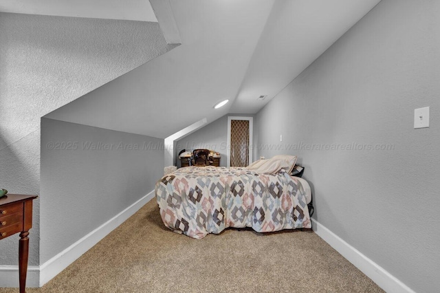 809 W 15th St, Jasper, AL 35501 - carpeted bedroom with lofted ceiling and baseboards