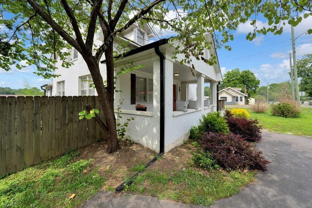 809 W 15th St, Jasper, AL 35501 - view of property exterior with a porch and brick siding