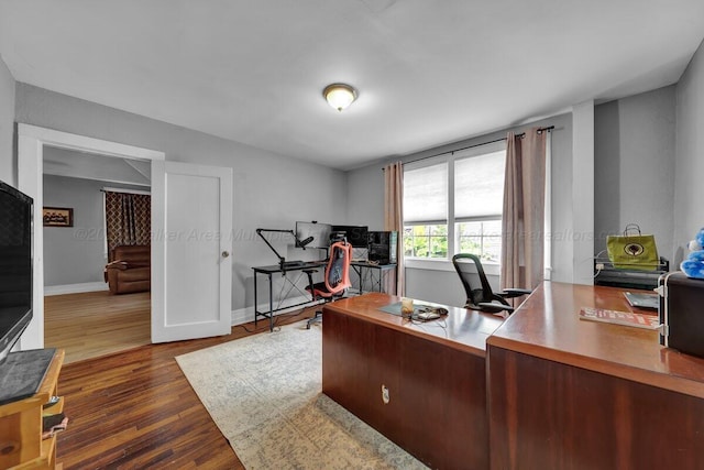 809 W 15th St, Jasper, AL 35501 - office space featuring dark wood-style flooring and baseboards