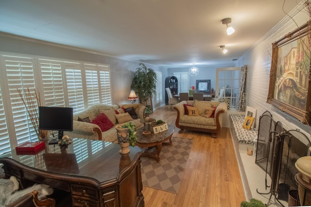1602 27th St, Haleyville, AL 35565 - living room featuring light wood-style floors and ornamental molding