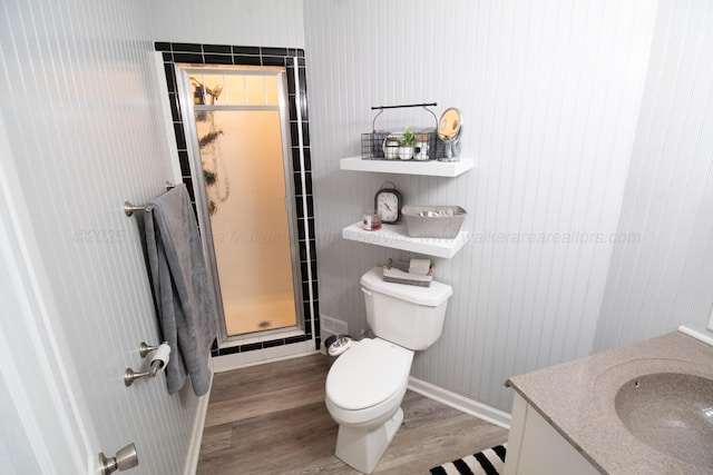 1602 27th St, Haleyville, AL 35565 - full bath with wood finished floors, vanity, and a shower stall