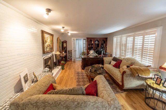 1602 27th St, Haleyville, AL 35565 - living area with wood finished floors, crown molding, and brick wall