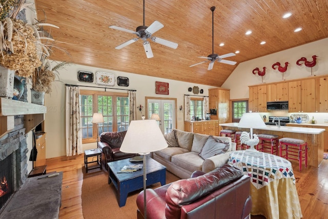 1617 S Stoney Rd, Double Springs, AL 35553 - living area featuring wood ceiling, a stone fireplace, light wood-style floors, recessed lighting, and a ceiling fan