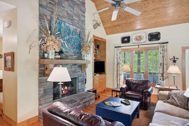 1617 S Stoney Rd, Double Springs, AL 35553 - living room with lofted ceiling, wood finished floors, wooden ceiling, a stone fireplace, and ceiling fan
