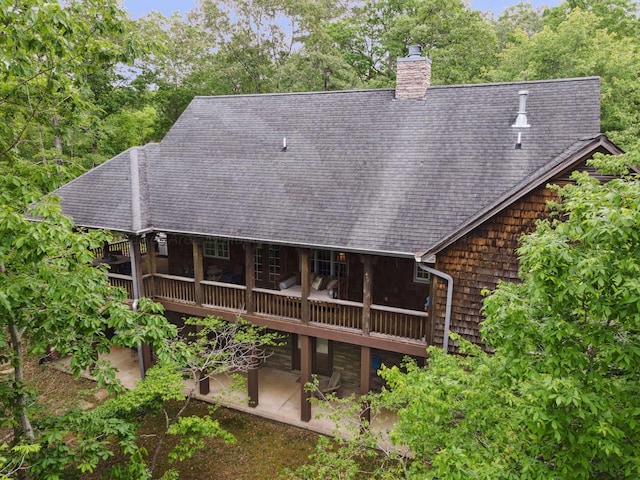 1617 S Stoney Rd, Double Springs, AL 35553 - rear view of house with a patio, a chimney, a wooden deck, and a shingled roof