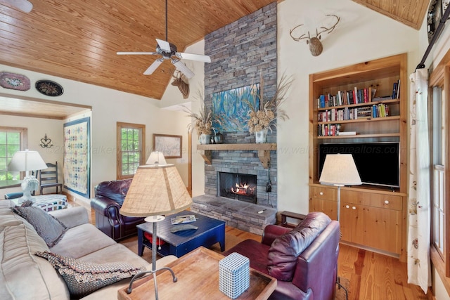 1617 S Stoney Rd, Double Springs, AL 35553 - living area featuring wooden ceiling, a ceiling fan, wood finished floors, high vaulted ceiling, and a stone fireplace