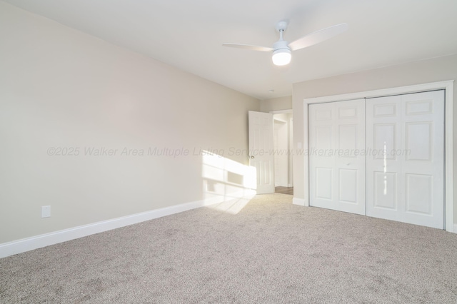 204 NW Piney Dr, Cullman, AL 35055 - unfurnished bedroom with a ceiling fan, carpet floors, baseboards, and a closet