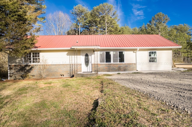204 NW Piney Dr, Cullman, AL 35055 - ranch-style home featuring brick siding, a front yard, and metal roof