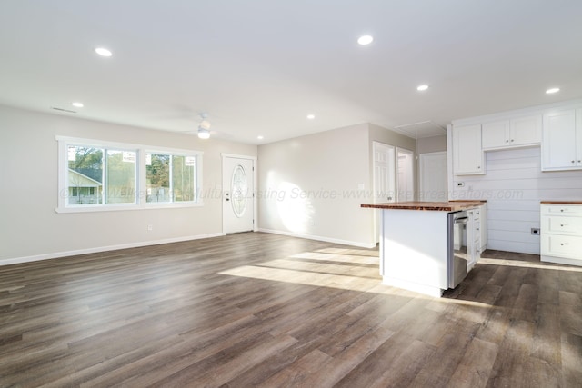 204 NW Piney Dr, Cullman, AL 35055 - kitchen featuring white cabinetry, butcher block countertops, recessed lighting, and dark wood-style flooring