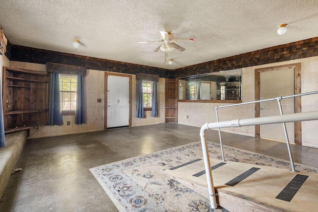 foyer featuring plenty of natural light and a textured ceiling