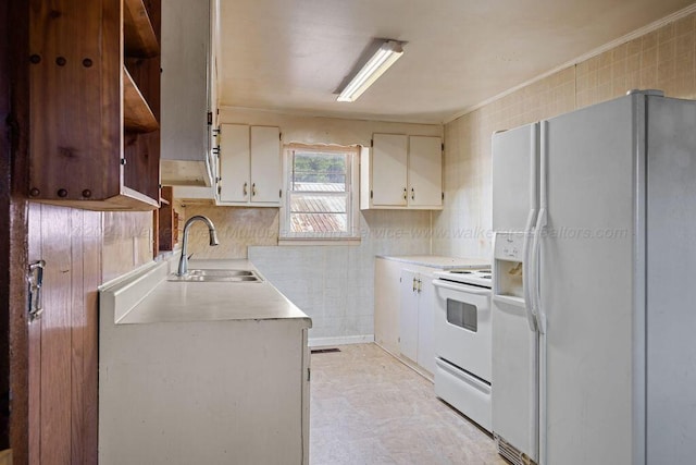 kitchen featuring tile walls, sink, white appliances, and ornamental molding