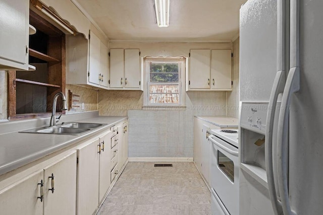 kitchen with sink and white appliances