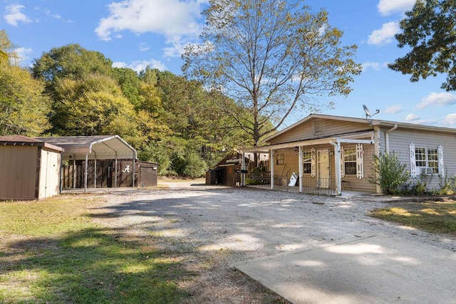 exterior space with a shed and a carport