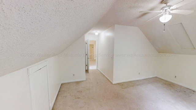1704 Sharon Ln, Jasper, AL 35504 - bonus room with light carpet, a textured ceiling, a ceiling fan, baseboards, and vaulted ceiling