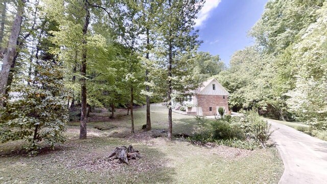 1704 Sharon Ln, Jasper, AL 35504 - unfinished below grade area featuring electric water heater