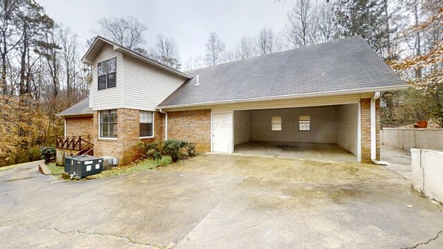 1704 Sharon Ln, Jasper, AL 35504 - view of property exterior with brick siding, an attached garage, and driveway