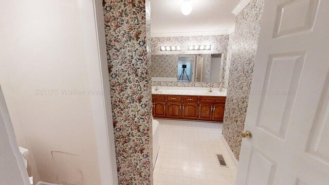 1704 Sharon Ln, Jasper, AL 35504 - full bathroom featuring visible vents, double vanity, tile patterned flooring, ornamental molding, and baseboards
