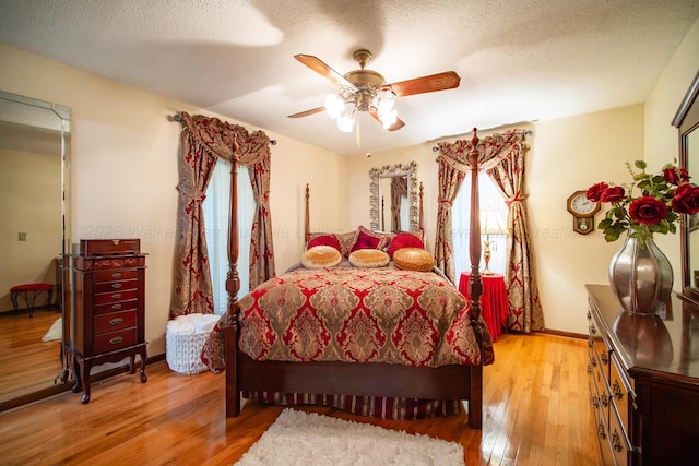 1925 Sharon Blvd, Dora, AL 35062 - bedroom with light wood finished floors, a textured ceiling, a ceiling fan, and baseboards