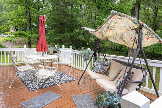 1925 Sharon Blvd, Dora, AL 35062 - wooden terrace featuring outdoor dining space, view of wooded area, and outdoor lounge area