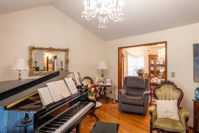 1925 Sharon Blvd, Dora, AL 35062 - living area with lofted ceiling, wood finished floors, and a chandelier
