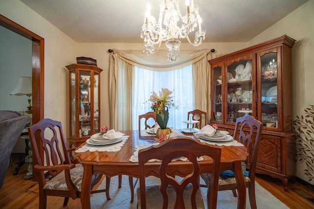1925 Sharon Blvd, Dora, AL 35062 - dining space with wood finished floors, a chandelier, and a textured ceiling