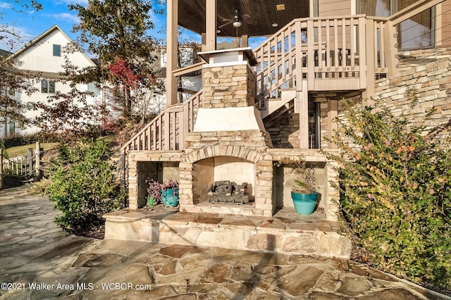 60 Sunset Dr, Arley, AL 35541 - view of patio / terrace with an outdoor stone fireplace, stairway, and a ceiling fan