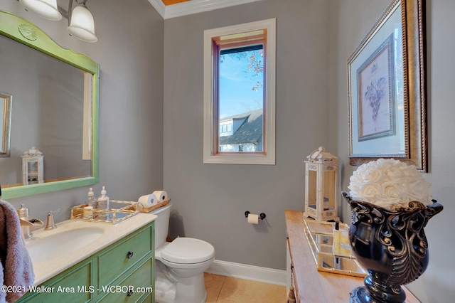 60 Sunset Dr, Arley, AL 35541 - half bathroom featuring tile patterned flooring, vanity, toilet, ornamental molding, and baseboards