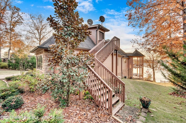 60 Sunset Dr, Arley, AL 35541 - view of side of property featuring stone siding, stairs, roof with shingles, and a yard