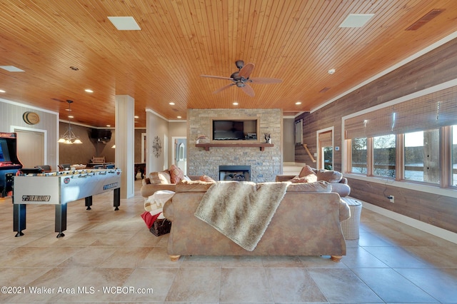 60 Sunset Dr, Arley, AL 35541 - living room with a fireplace, wooden ceiling, wood walls, and a ceiling fan