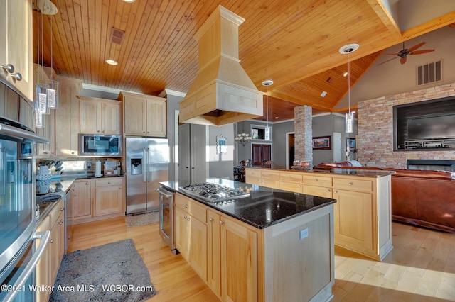 60 Sunset Dr, Arley, AL 35541 - kitchen with open floor plan, stainless steel appliances, a kitchen island, wood ceiling, and light brown cabinets