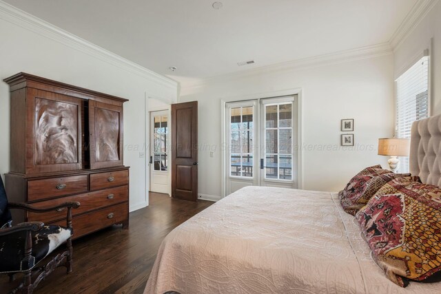 bedroom featuring baseboards, visible vents, dark wood-type flooring, and ornamental molding