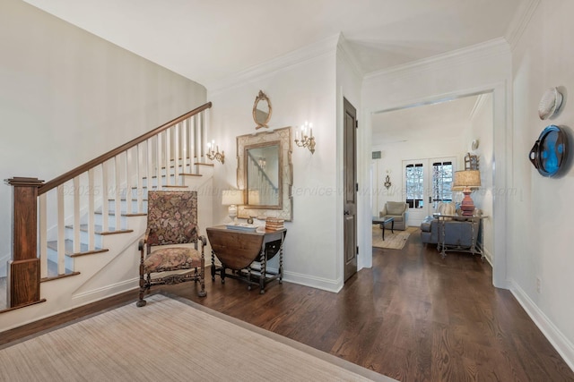 entryway with baseboards, wood finished floors, stairs, and ornamental molding