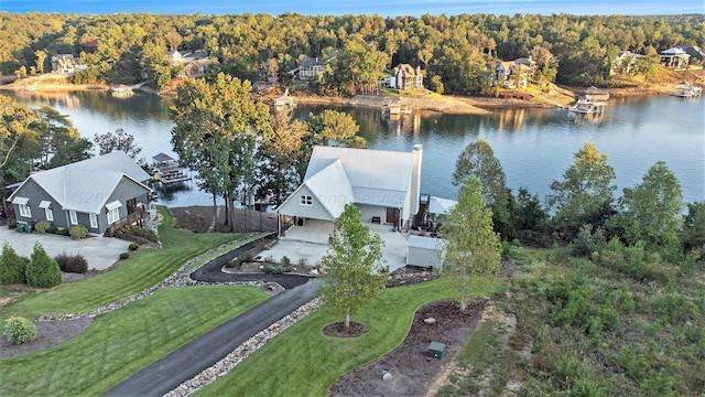 birds eye view of property with a water view