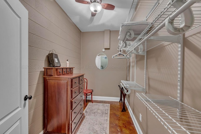 walk in closet featuring ceiling fan