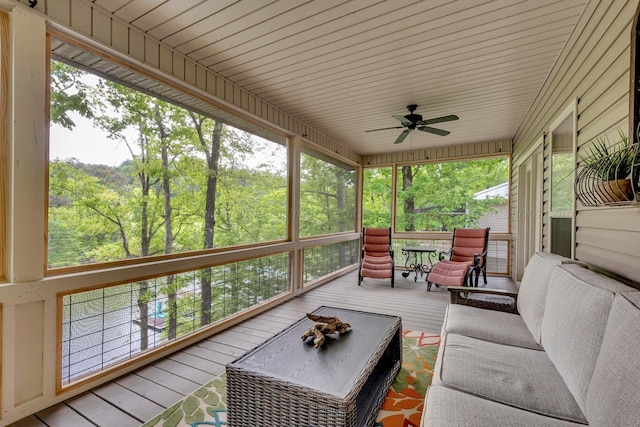 sunroom with plenty of natural light and ceiling fan