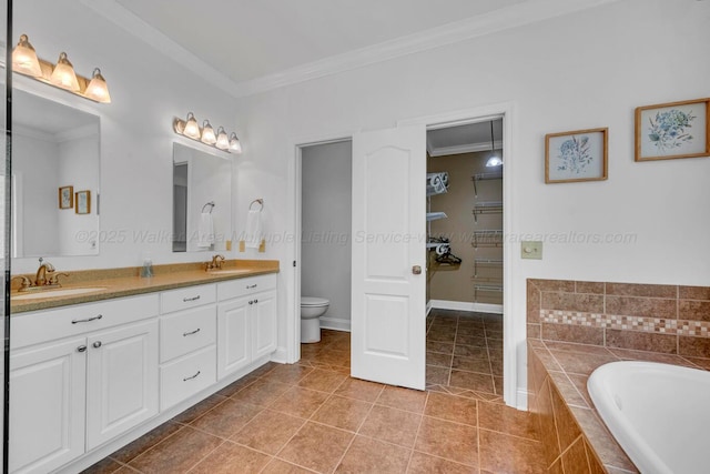 full bath featuring crown molding, toilet, tile patterned floors, and a sink