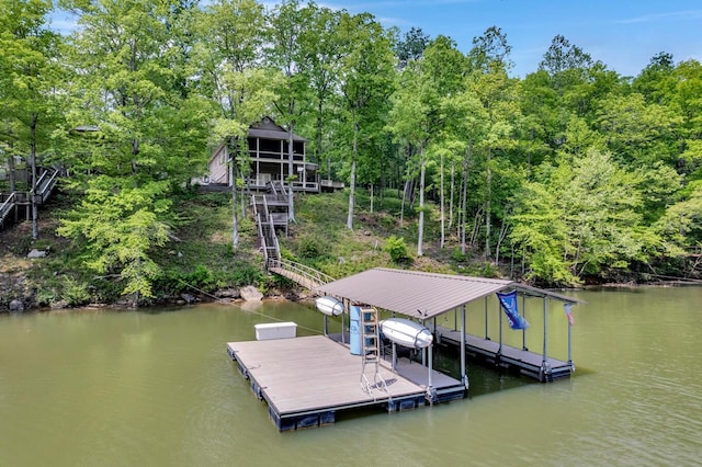 dock area featuring stairs and a water view