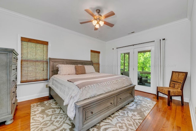 bedroom featuring crown molding, light wood-style floors, visible vents, and access to exterior